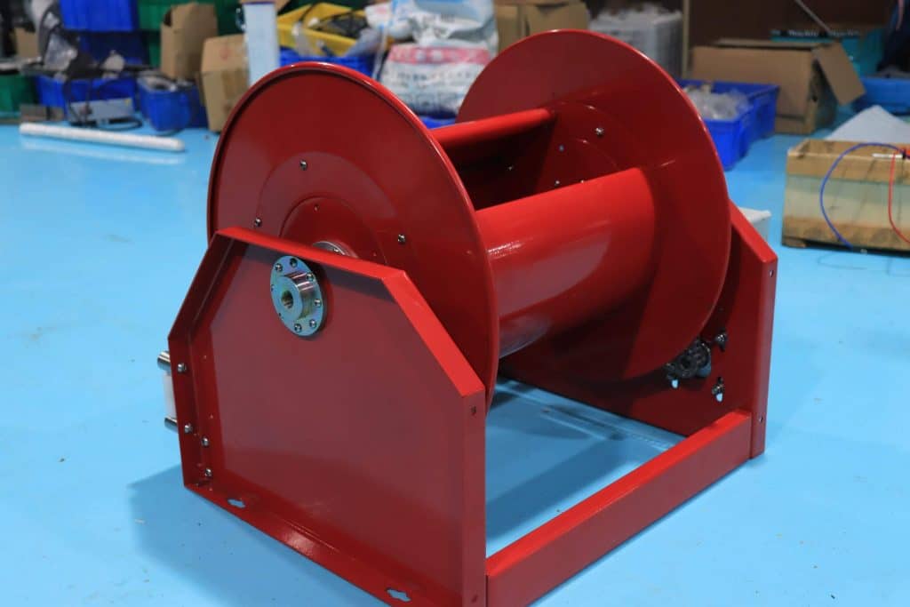 Heavy-duty motorized cable reel maintenance at factory